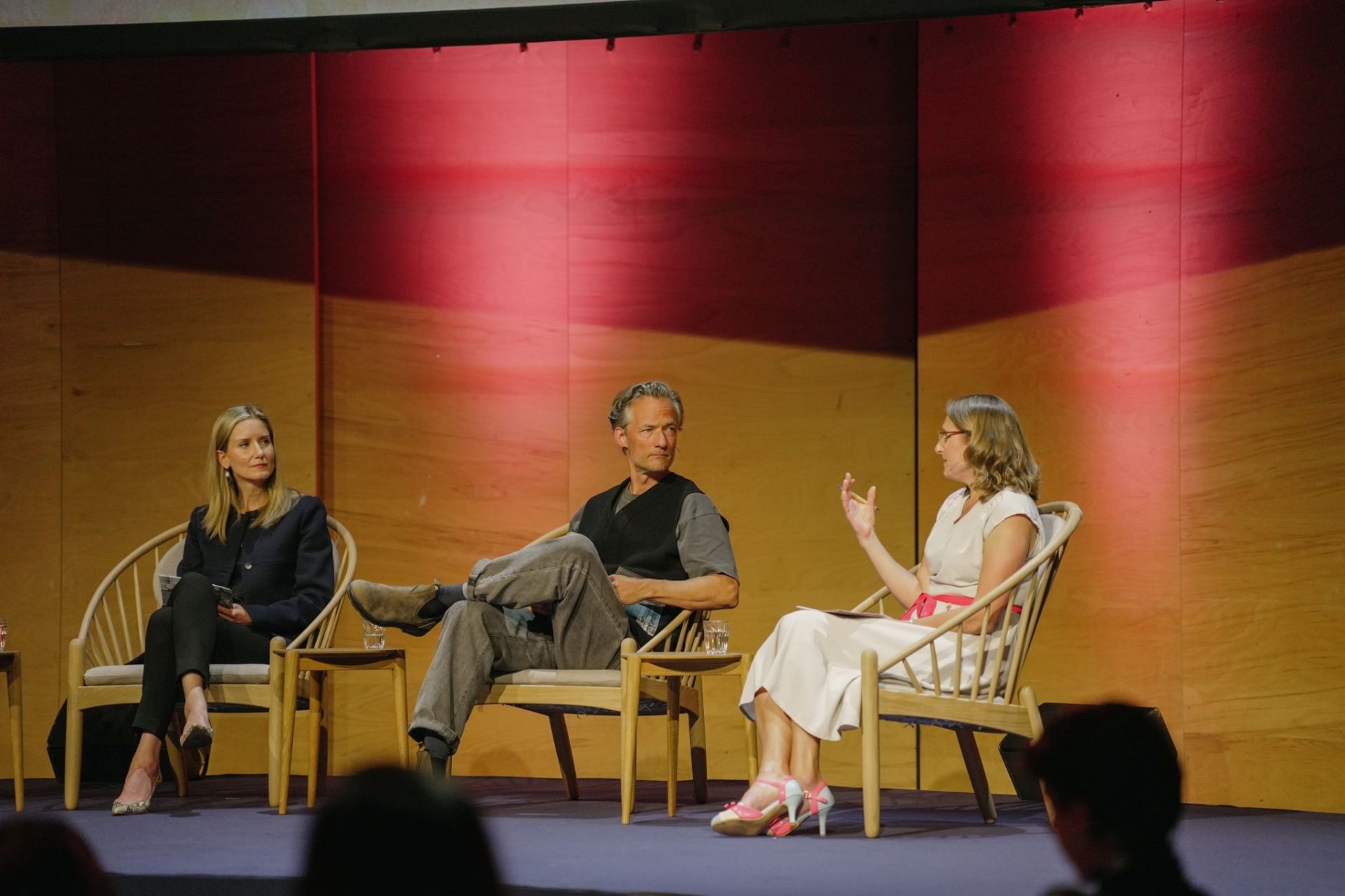 Reniera moderating a panel at the Global Fashion Summit